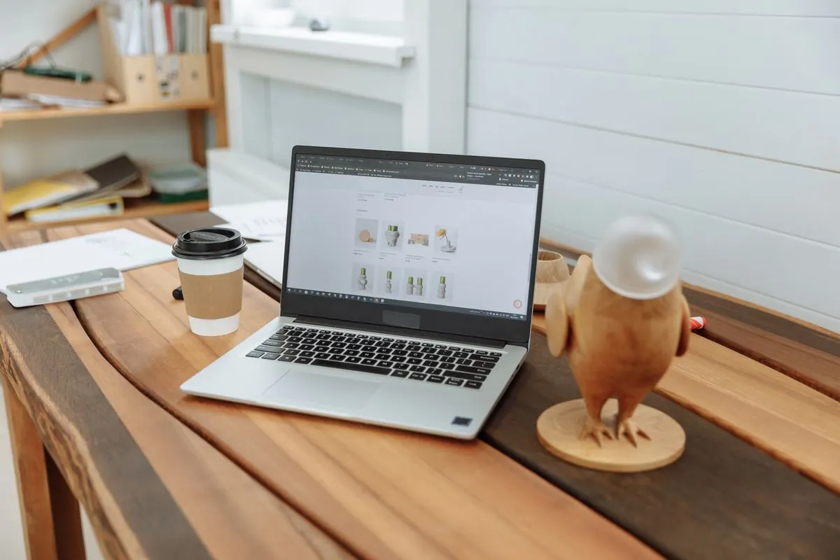Laptop and coffee on a contemporary wooden workspace